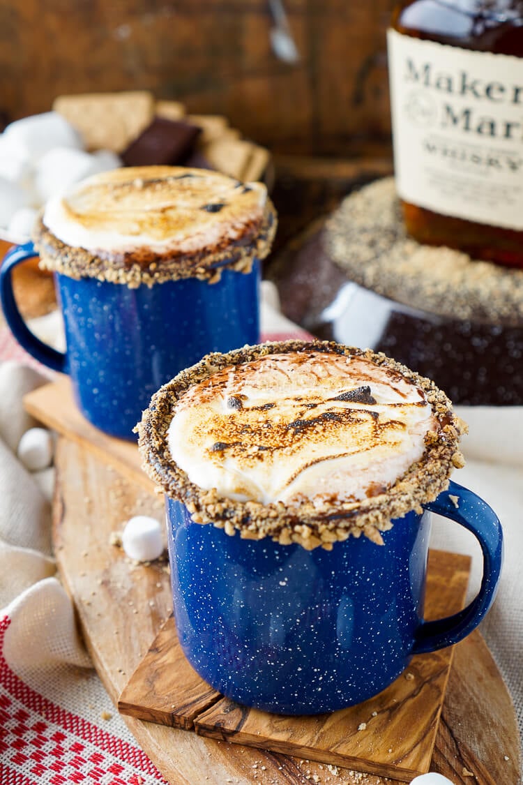 This Campfire S'mores Hot Chocolate Cocktail is laced with whiskey and honey for a smooth and cozy drink!