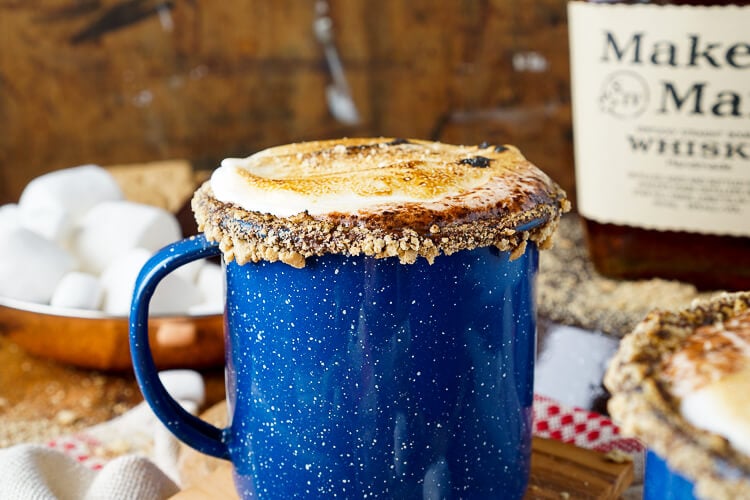 This Campfire S'mores Hot Chocolate Cocktail is laced with whiskey and honey for a smooth and cozy drink!