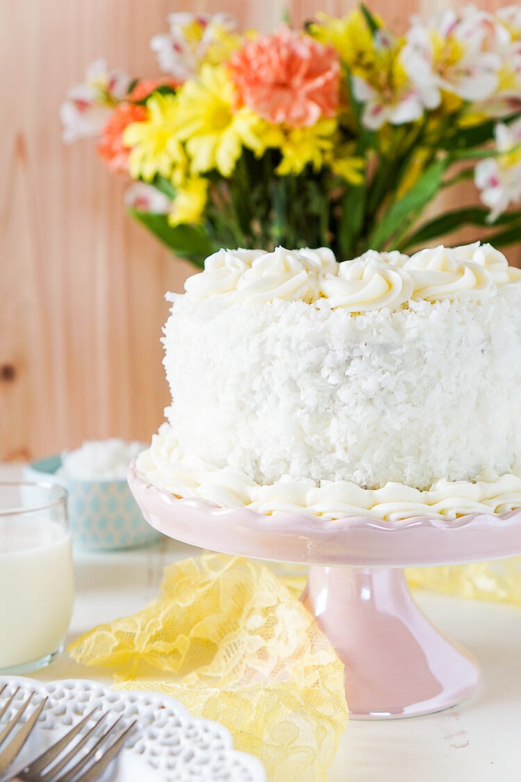 This Classic Coconut Cake is the perfect Easter dessert! Light and fluffy with a cream cheese frosting laced with the essence of sweet coconut!