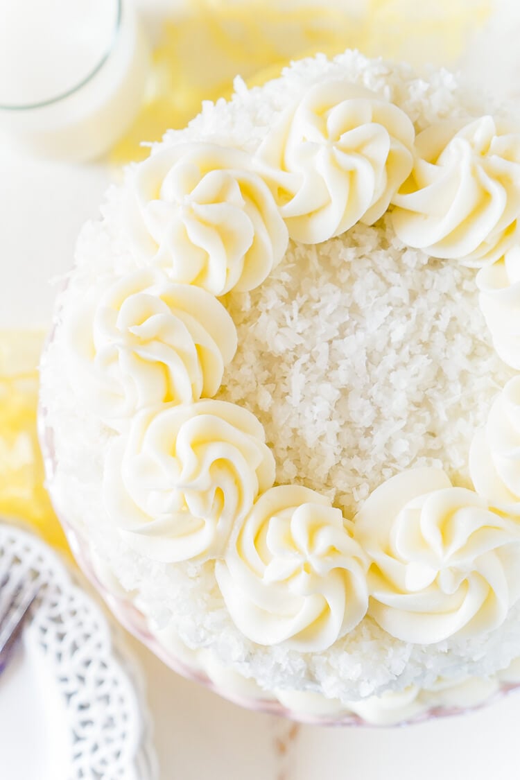 This Classic Coconut Cake is the perfect Easter dessert! Light and fluffy with a cream cheese frosting laced with the essence of sweet coconut!