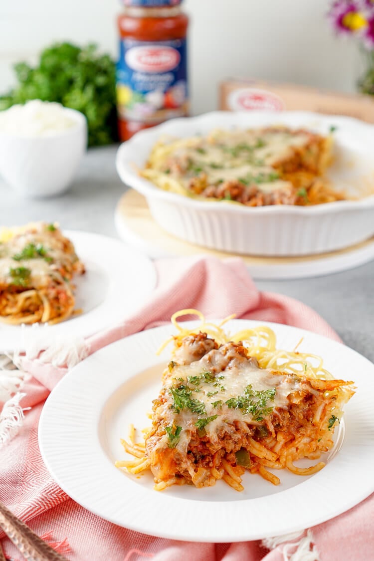 Baked Spaghetti Pie is an easy and delicious dinner recipe. Al dente spaghetti topped with meat sauce and layer of melty cheese.