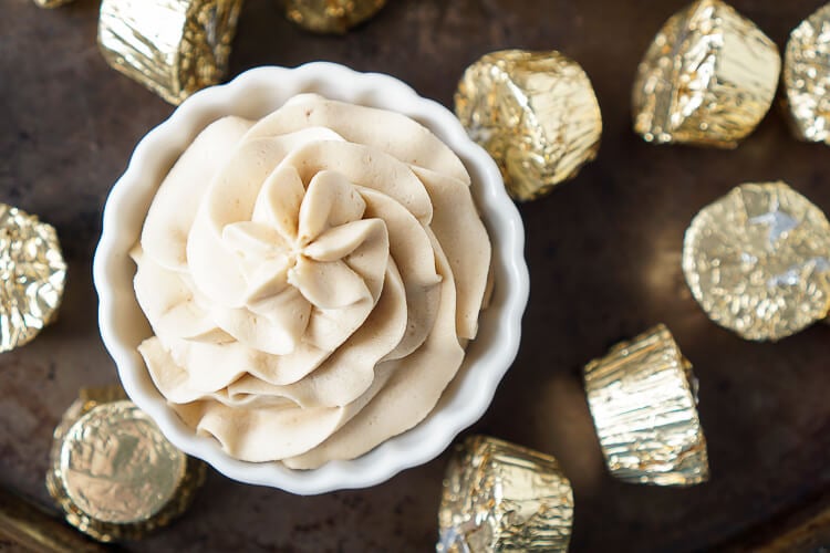 This Cookie Butter Frosting recipe is creamy and fluffy and perfect for topping cupcakes, sandwiching between cookies, or frosting cakes with!