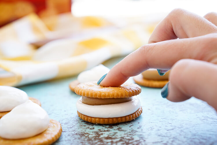 These Fluffernutter RITZwiches are a fun mix of two childhood classics! Who doesn't love peanut butter and marshmallow fluff sandwiched between two buttery RITZ crackers! It's the ultimate easy snack that's ready in just a 5 minutes! You can trade out the peanut butter for cookie butter or sun butter too!