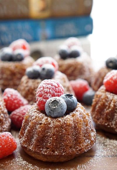 This Game of Thrones Honey Cake recipe can be made up ahead of time and is loaded with comforting flavors like honey, cinnamon, and nutmeg and laced with coffee, orange juice, and bourbon.