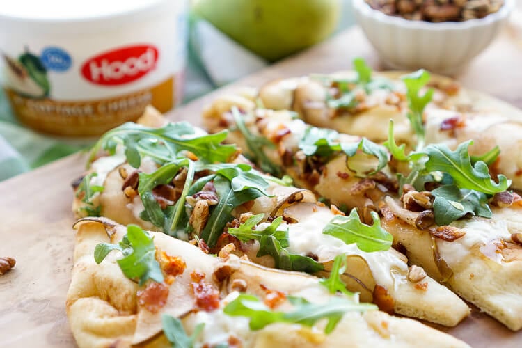 This Honey Pear Pecan Bacon Flatbread is the perfect light lunch, snack, or appetizer and just the slightest bit sweet!