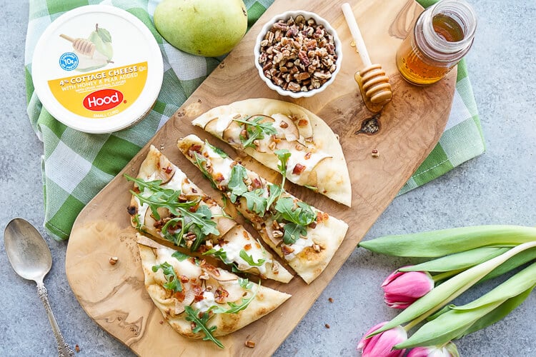 This Honey Pear Pecan Bacon Flatbread is the perfect light lunch, snack, or appetizer and just the slightest bit sweet!