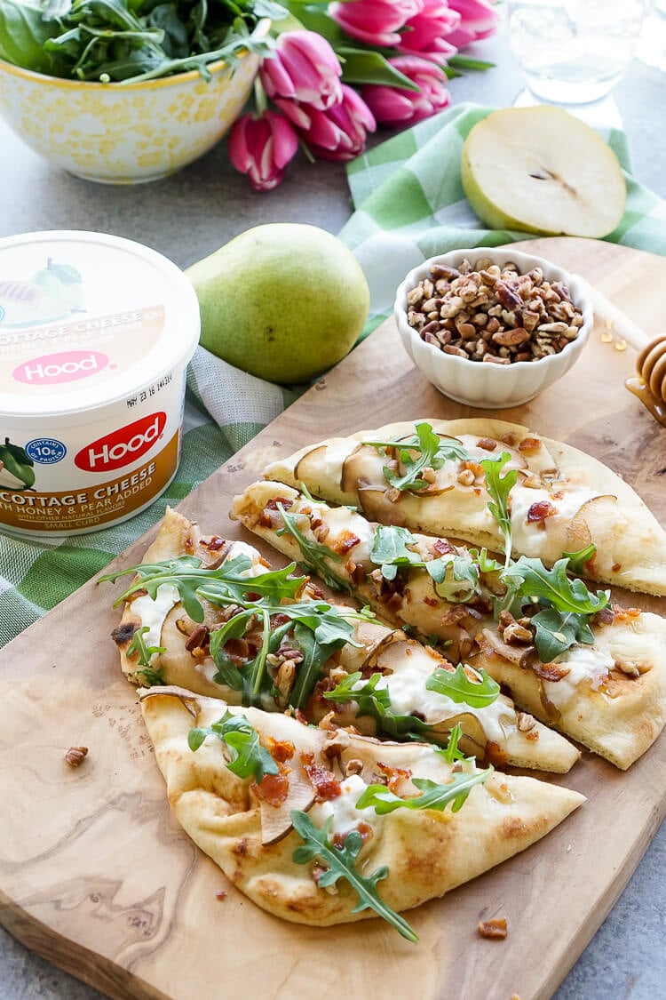 This Honey Pear Pecan Bacon Flatbread is the perfect light lunch, snack, or appetizer and just the slightest bit sweet!