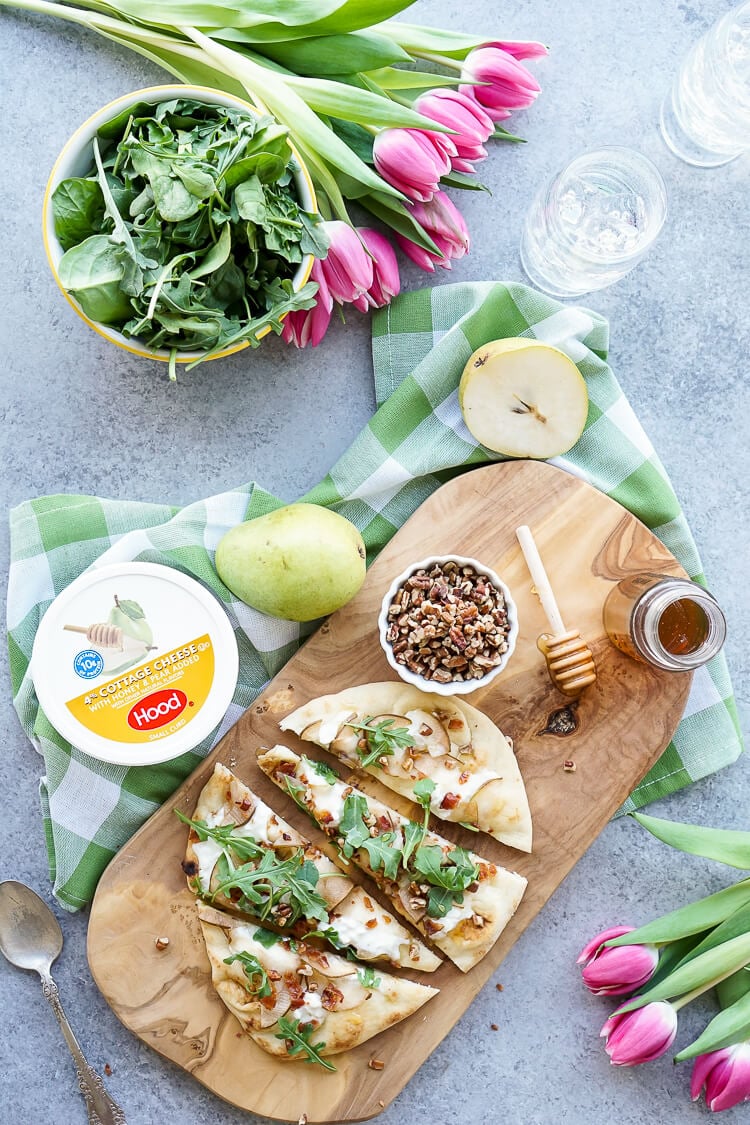 This Honey Pear Pecan Bacon Flatbread is the perfect light lunch, snack, or appetizer and just the slightest bit sweet!