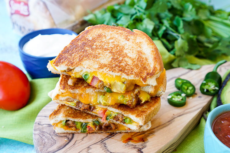 This Taco Grilled Cheese Sandwich can be customized just like a taco! The original recipe is packed with bold flavor and a little heat for a lunch or dinner that's sure to leave your mouth watering!