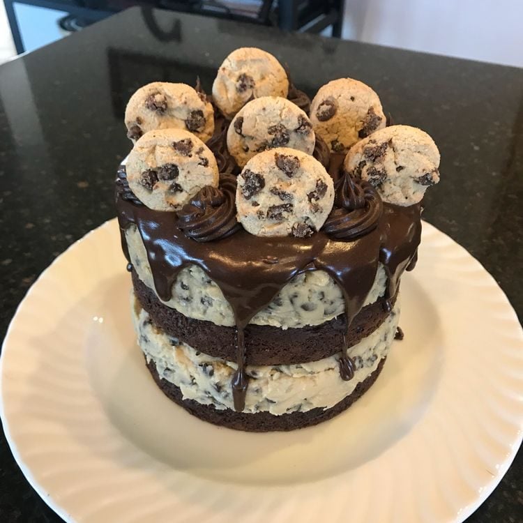 This Chocolate Chip Cookie Dough Cake is made with two layers of delicious chocolate cake, and two layers of edible cookie dough then topped with ganache, frosting, and mini chocolate chip cookies!
