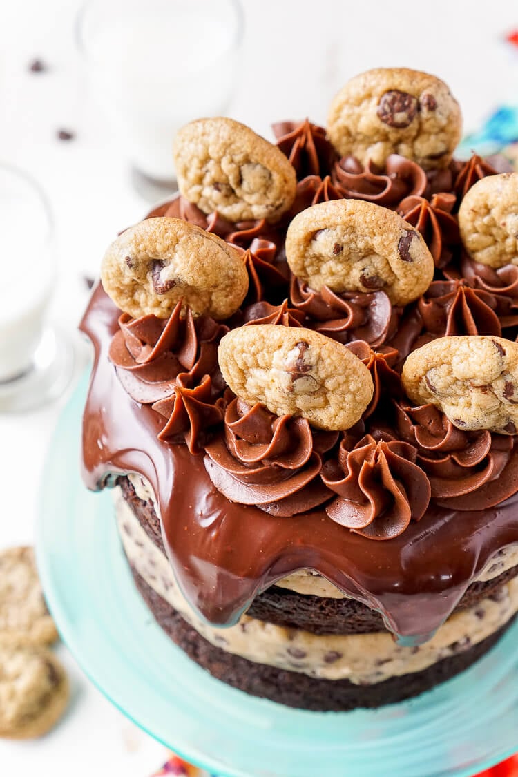 This Chocolate Chip Cookie Dough Cake is made with two layers of delicious chocolate cake and two layers of edible cookie dough then topped with ganache, frosting and mini chocolate chip cookies!