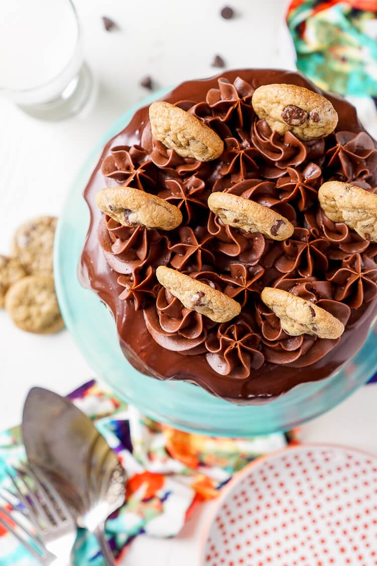 This Chocolate Chip Cookie Dough Cake is made with two layers of delicious chocolate cake and two layers of edible cookie dough then topped with ganache, frosting and mini chocolate chip cookies!