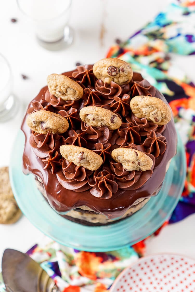 This Chocolate Chip Cookie Dough Cake is made with two layers of delicious chocolate cake and two layers of edible cookie dough then topped with ganache, frosting and mini chocolate chip cookies!