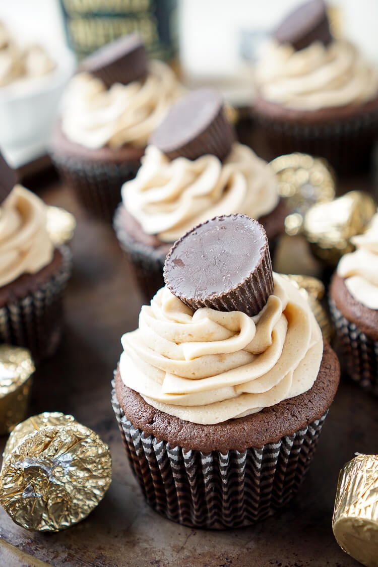 These Cookie Butter Chocolate Cupcakes are rich, sweet, and easy to make! An adapted cake box mix makes up the moist cupcakes and then they're topped with a silky smooth cookie butter frosting and a cookie butter cup!