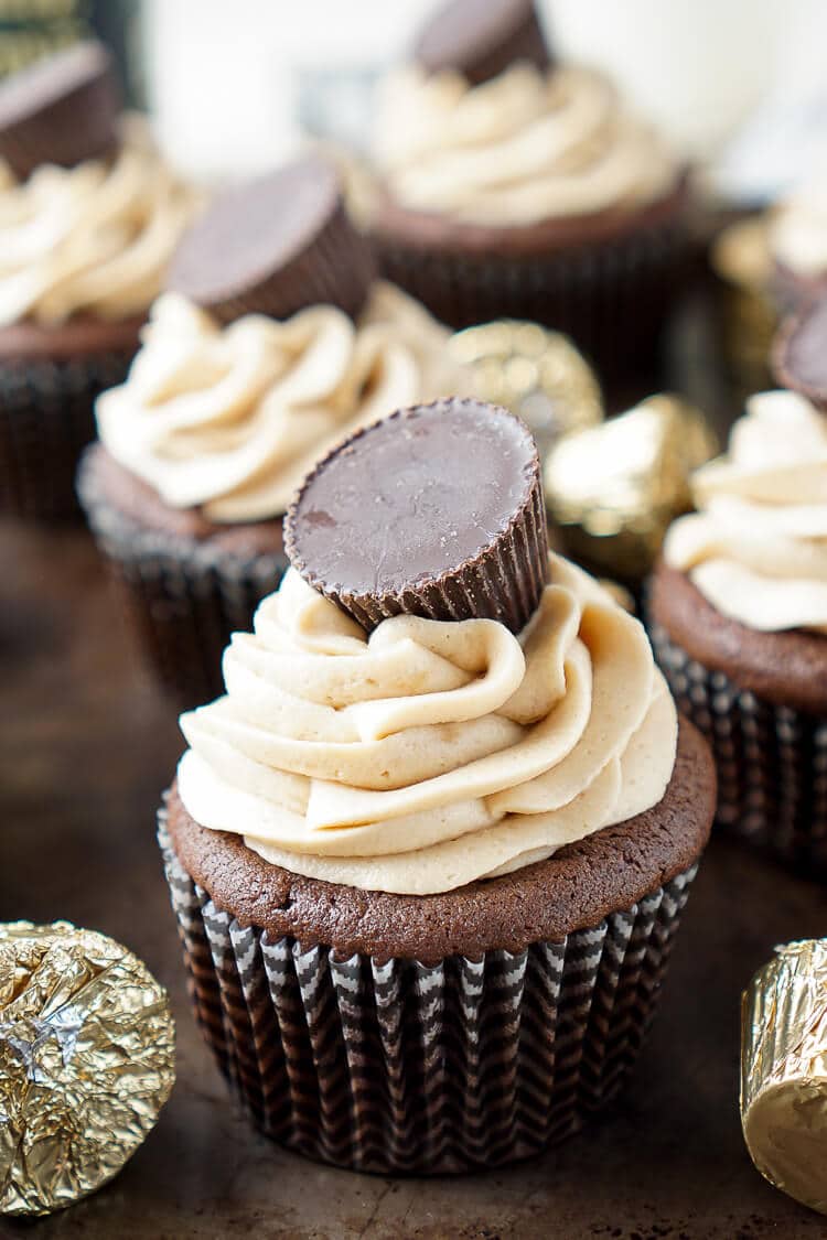 These Cookie Butter Chocolate Cupcakes are rich, sweet, and easy to make! An adapted cake box mix makes up the moist cupcakes and then they're topped with a silky smooth cookie butter frosting and a cookie butter cup!