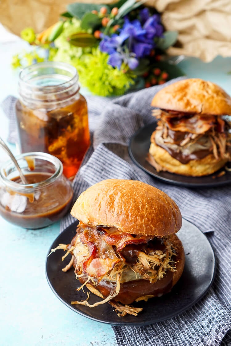 This Meat Lovers Cheeseburger is loaded up with a burger, pulled pork, and bacon! Topped with cheese and a sweet and tangy sauce, it's the ultimate burger!