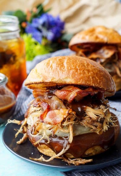 This Meat Lovers Cheeseburger is loaded up with a burger, pulled pork, and bacon! Topped with cheese and a sweet and tangy sauce, it's the ultimate burger!