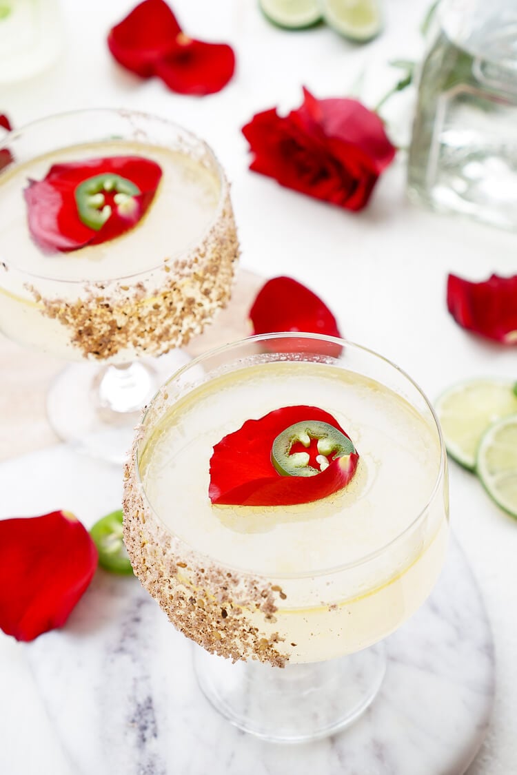 This Rosa Picante Margarita is the Patrón Margarita of the Year! Expertly crafted, artfully presented, and it tastes as smooth as it looks! A mix of tequila, lime juice, rosewater, ginger syrup, and jalapeno oil make for a refined spicy cocktail that will knock your socks off!