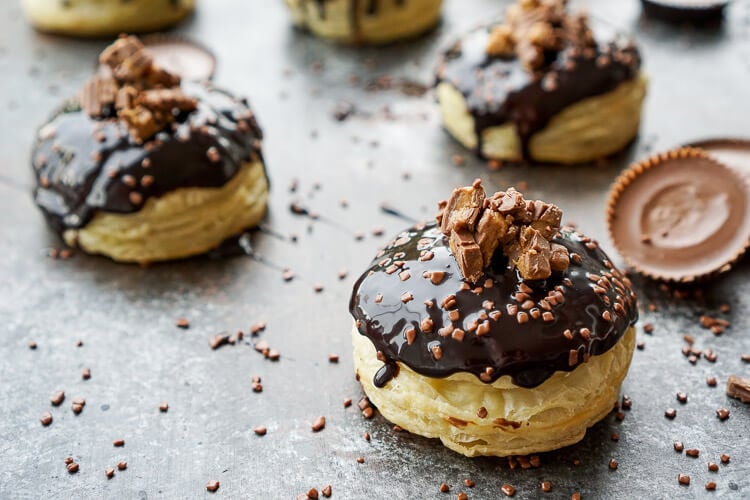 These Reese's Stuffed Puff Pastry Donuts are rich, decadent, and easy to make! Just 6 ingredients stand between you and chocolate-peanut butter bliss!