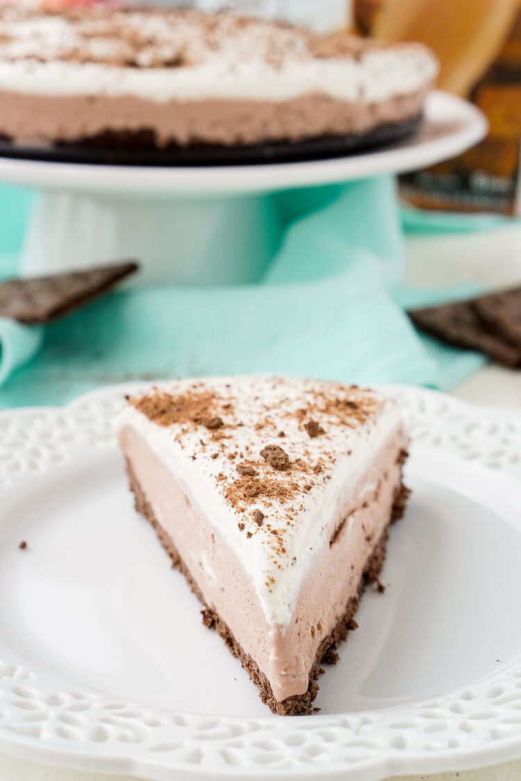 This Skinny Ice Cream Cake is everything you love about the classic dessert, but lighter! A layer of chocolate graham cracker is topped with a creamy chocolate center and topped with whipped topping for a cold summer treat everyone will love!