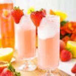 These Strawberry Lemonade Floats are an instant summer classic! Sweet and tart swirl together for an easy and delicious warm weather treat!