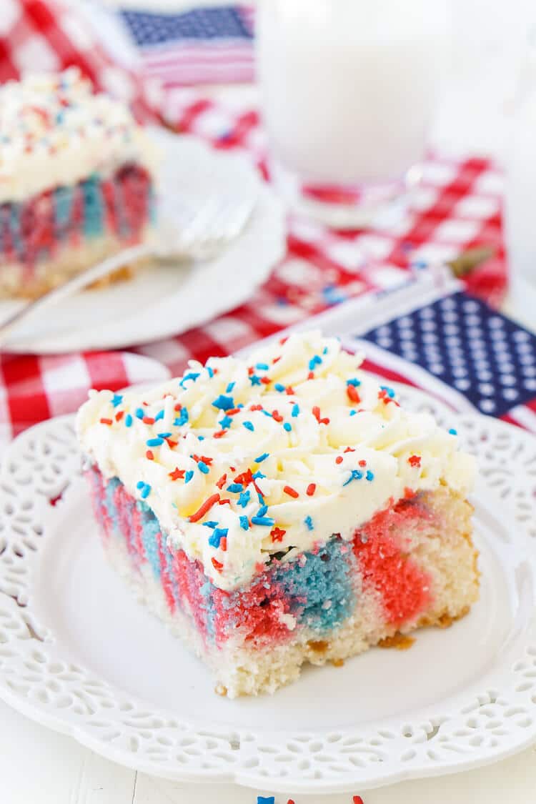 This Red, White, and Blue Marble Sheet Cake is made with an adapted cake box mix and topped with a whipped white chocolate frosting. It's the perfect patriotic dessert for the 4th of July!