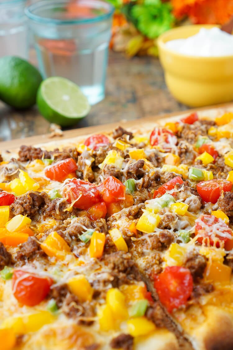 Mix up your Taco Tuesday menu with this Taco Pizza, it's everything you love about the classic weeknight meal on a delicious flatbread for a quick and easy dinner idea the whole family will love!