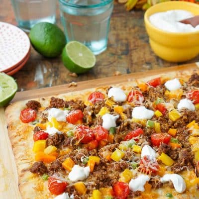 Mix up your Taco Tuesday menu with this Taco Pizza, it's everything you love about the classic weeknight meal on a delicious flatbread for a quick and easy dinner idea the whole family will love!