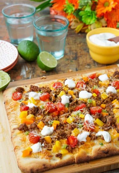 Mix up your Taco Tuesday menu with this Taco Pizza, it's everything you love about the classic weeknight meal on a delicious flatbread for a quick and easy dinner idea the whole family will love!