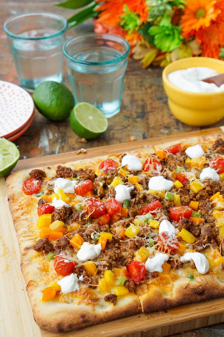 Mix up your Taco Tuesday menu with this Taco Pizza, it's everything you love about the classic weeknight meal on a delicious flatbread for a quick and easy dinner idea the whole family will love!