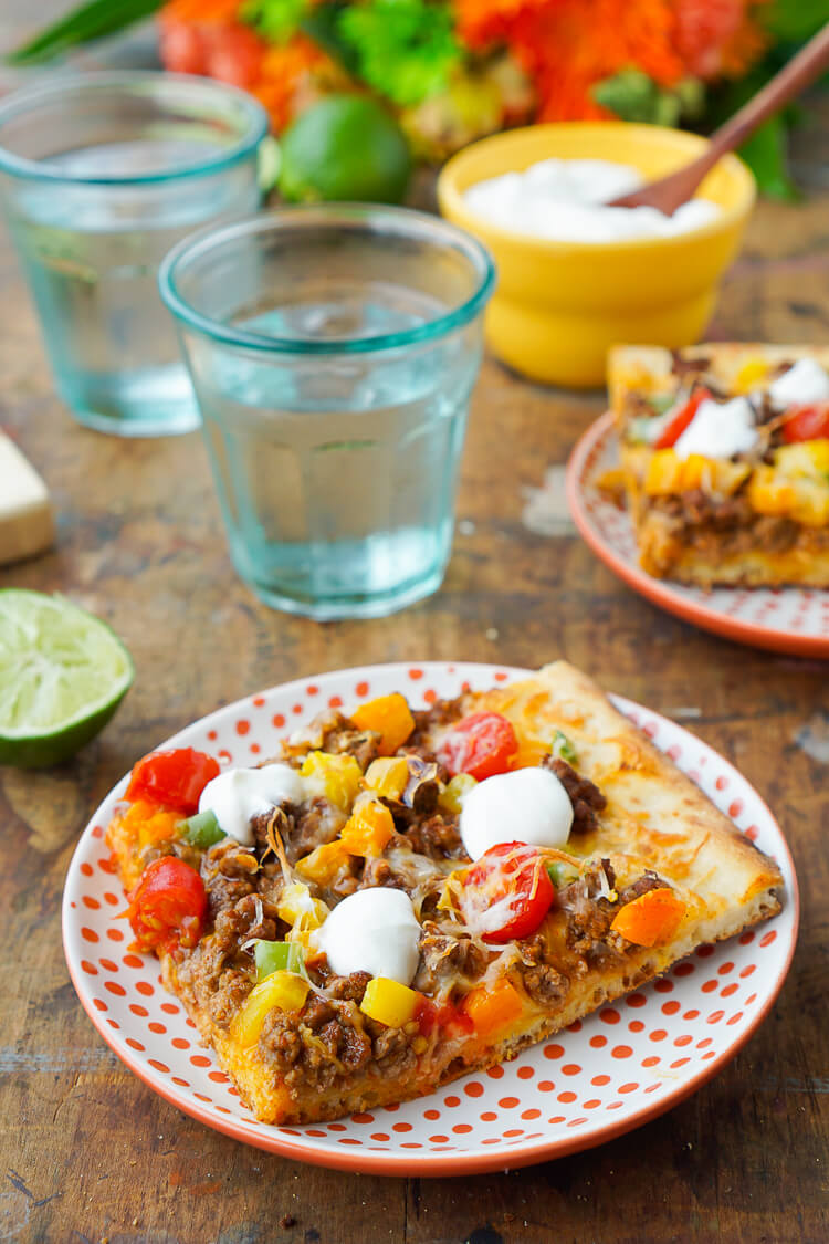 Mix up your Taco Tuesday menu with this Taco Pizza, it's everything you love about the classic weeknight meal on a delicious flatbread for a quick and easy dinner idea the whole family will love!