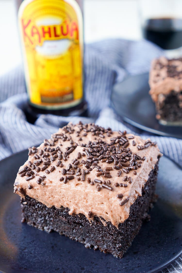 This Kahlua Chocolate Poke Cake is a deliciously boozy dessert that will get any party started! This Chocolate cake is baked with, soaked in, and frosted with Kahlua. It's the ultimate boozy dessert!