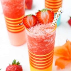 This really is The Best Strawberry Daiquiri recipe! It's a slushy blend of fresh strawberries, citrus, ice, and rum - it's easy to make and it will only take a couple of these frozen cocktails to have you feeling lively!