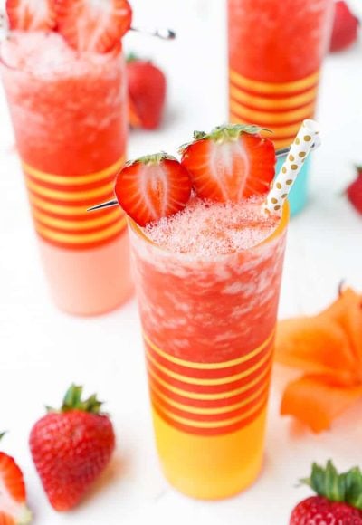 This really is The Best Strawberry Daiquiri recipe! It's a slushy blend of fresh strawberries, citrus, ice, and rum - it's easy to make and it will only take a couple of these frozen cocktails to have you feeling lively!