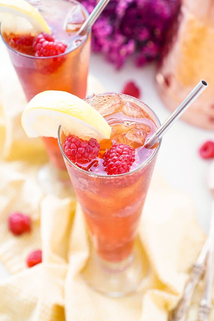 This Easy Raspberry Iced Tea recipe is a refreshingly sweet drink you'll want to sip all summer long! Made with just 4 ingredients, you can have a large party pitcher ready with only 10 minutes of work.