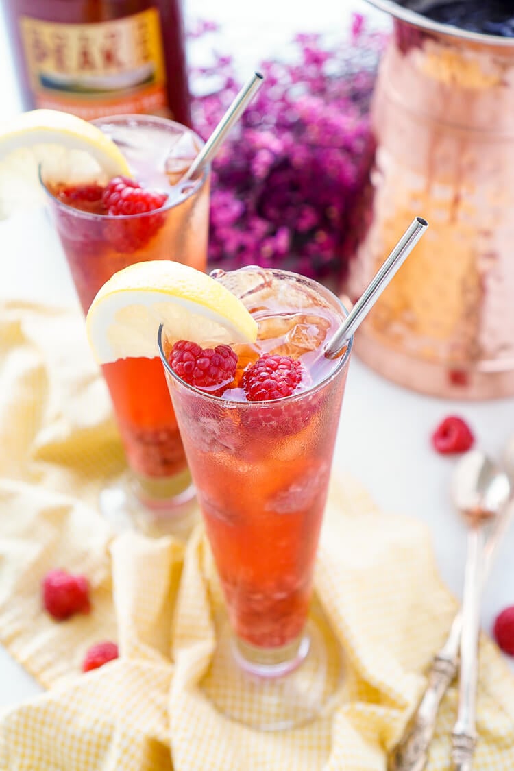 This Easy Raspberry Iced Tea recipe is a refreshingly sweet drink you'll want to sip all summer long! Made with just 4 ingredients, you can have a large party pitcher ready with only 10 minutes of work.