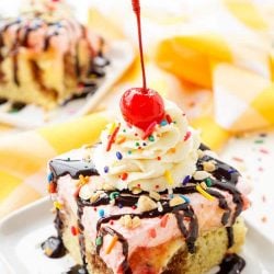 This Banana Split Cake will be the most fun dessert you'll make all summer! Layers of chocolate, vanilla, strawberry, banana, and the list goes on! Your family will beg you to make it again!