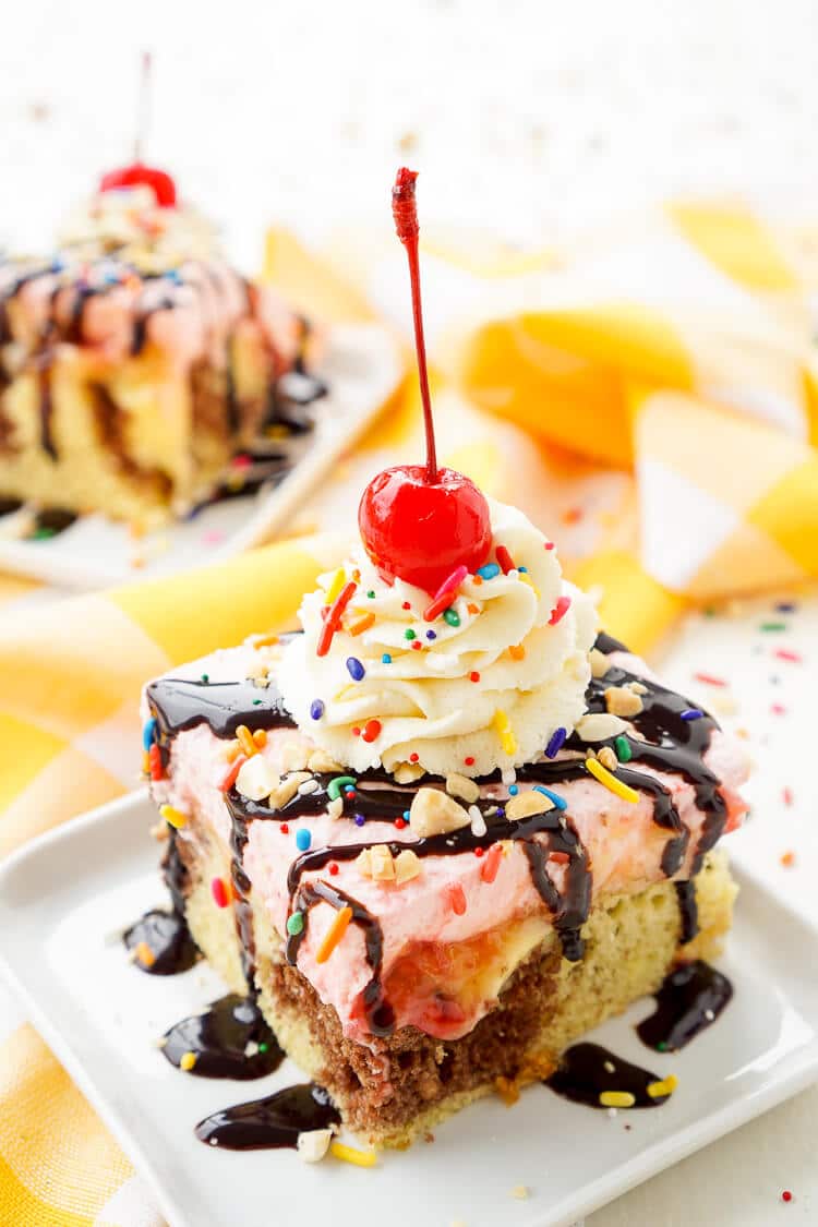 This Banana Split Cake will be the most fun dessert you'll make all summer! Layers of chocolate, vanilla, strawberry, banana, and the list goes on! Your family will beg you to make it again!