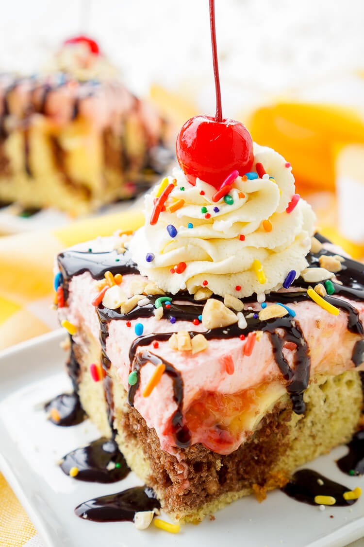 This Banana Split Cake will be the most fun dessert you'll make all summer! Layers of chocolate, vanilla, strawberry, banana, and the list goes on! Your family will beg you to make it again!