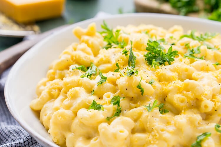 This really is the Best Ever Creamy Mac and Cheese! Made with sharp cheddar and Parmesan cheese, heavy cream and whole milk, richened with butter and kicked up with some mustard powder, you just can't go wrong! This stovetop mac and cheese recipe is on the table in just 25 minutes!