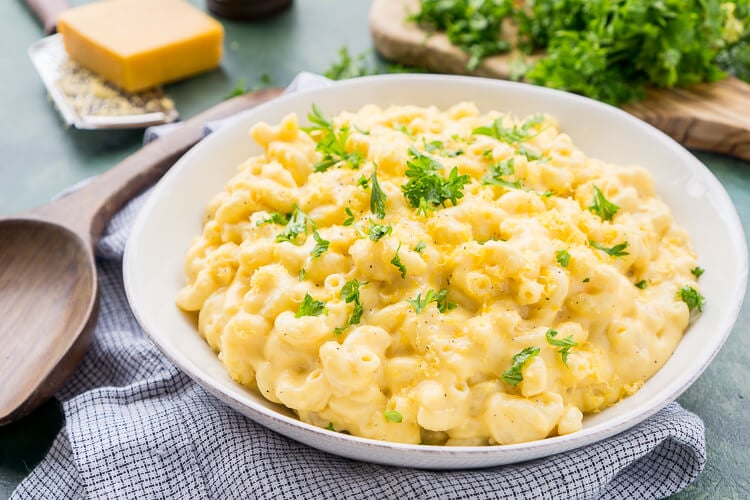 This really is the Best Ever Creamy Mac and Cheese! Made with sharp cheddar and Parmesan cheese, heavy cream and whole milk, richened with butter and kicked up with some mustard powder, you just can't go wrong! This stovetop mac and cheese recipe is on the table in just 25 minutes!