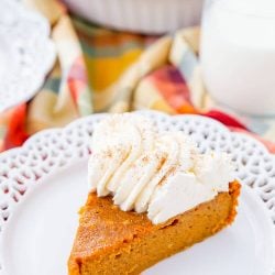 This Impossible Pumpkin Pie Recipe is actually the easiest pumpkin pie you'll ever make! As it bakes, it forms a light crust on its own and leaves behind a dense, but creamy pumpkin filling. Top it with whipped cream and it's the perfect fall dessert!