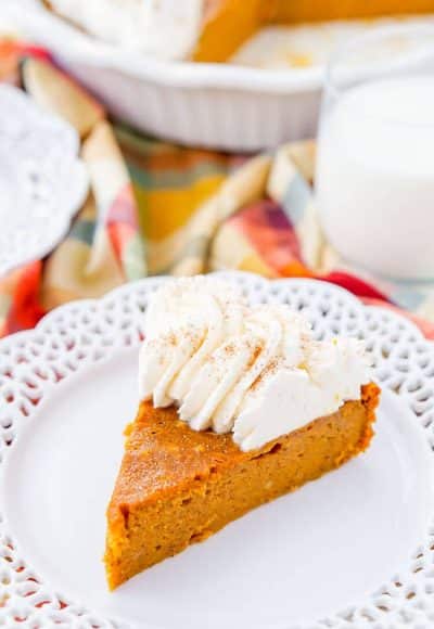 This Impossible Pumpkin Pie Recipe is actually the easiest pumpkin pie you'll ever make! As it bakes, it forms a light crust on its own and leaves behind a dense, but creamy pumpkin filling. Top it with whipped cream and it's the perfect fall dessert!