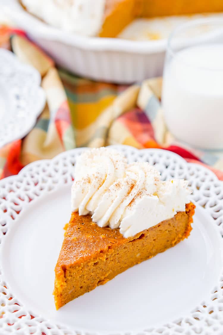 This Impossible Pumpkin Pie Recipe is actually the easiest pumpkin pie you'll ever make! As it bakes, it forms a light crust on its own and leaves behind a dense, but creamy pumpkin filling. Top it with whipped cream and it's the perfect fall dessert!