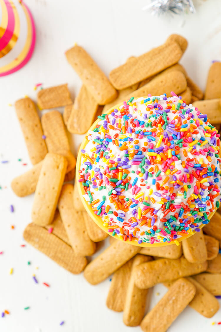 This Funfetti Birthday Cake Dip is perfect for serving up at parties or enjoying by yourself when a craving strikes! Ready in just 5 minutes and made with cake mix, cream cheese, cool whip, and rainbow sprinkles!