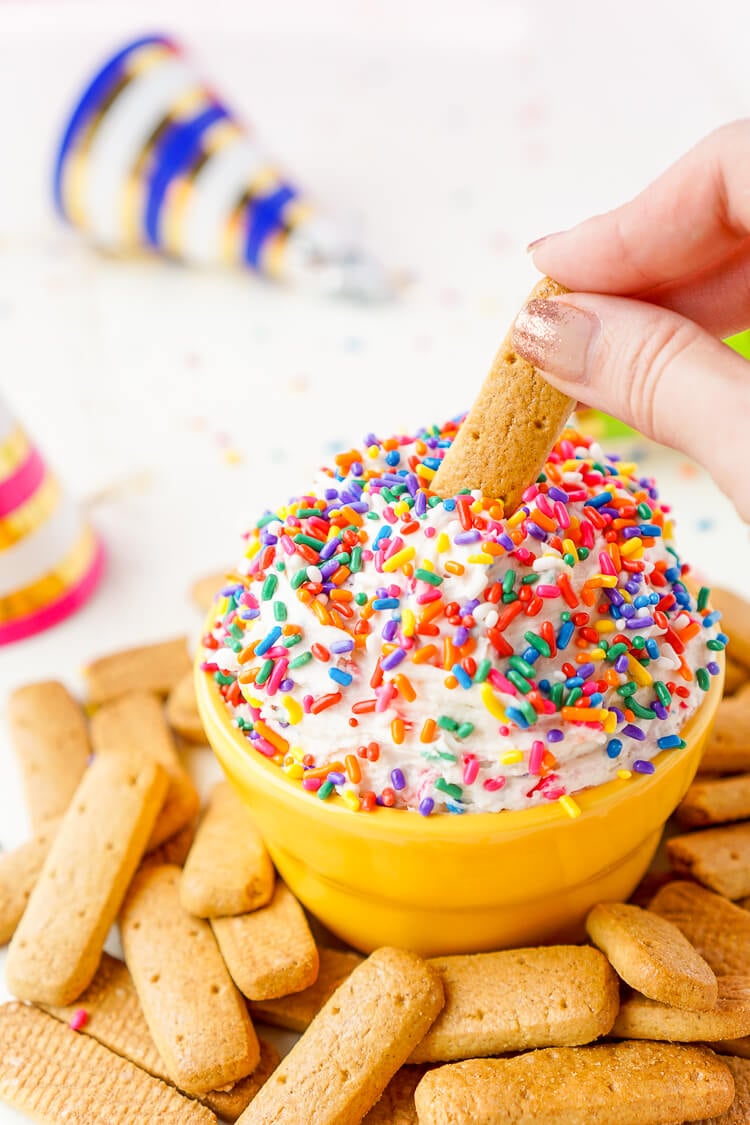 This Funfetti Birthday Cake Dip is perfect for serving up at parties or enjoying by yourself when a craving strikes! Ready in just 5 minutes and made with cake mix, cream cheese, cool whip, and rainbow sprinkles!