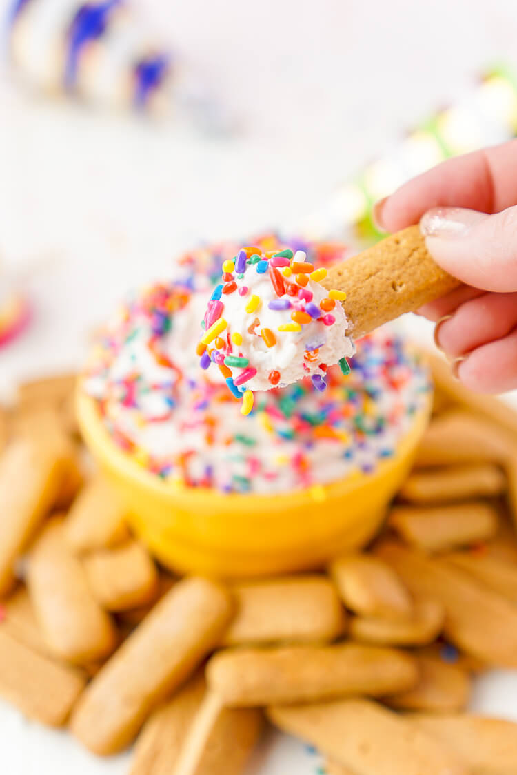 This Funfetti Birthday Cake Dip is perfect for serving up at parties or enjoying by yourself when a craving strikes! Ready in just 5 minutes and made with cake mix, cream cheese, cool whip, and rainbow sprinkles!