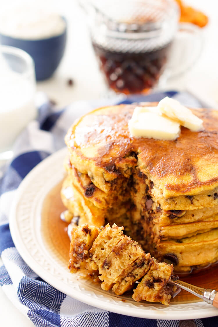 These Pumpkin Chocolate Chip Pancakes taste just like the classic fall cookie, except in this case you can drench them in maple syrup, smother them in butter, and eat them for breakfast!