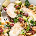 This Chicken Dinner is loaded with seasonal flavors and comes together in just 30 minutes! Roasted Brussels sprouts and red grapes mixed with shallots and garlic and the crunch of walnuts bring this whole meal to life!