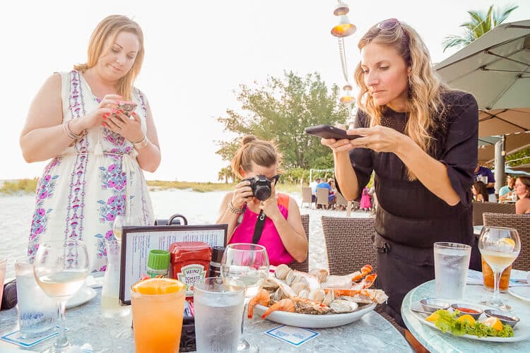 Bloggers taking photos on Anna Maria Island